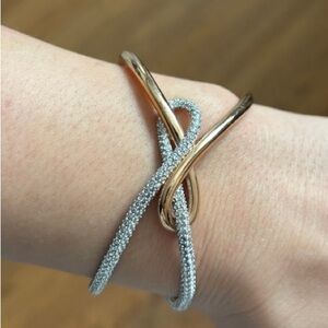 Swarovski Stamped Gold and Silver Tone Knot Shaped Women's Bracelet.